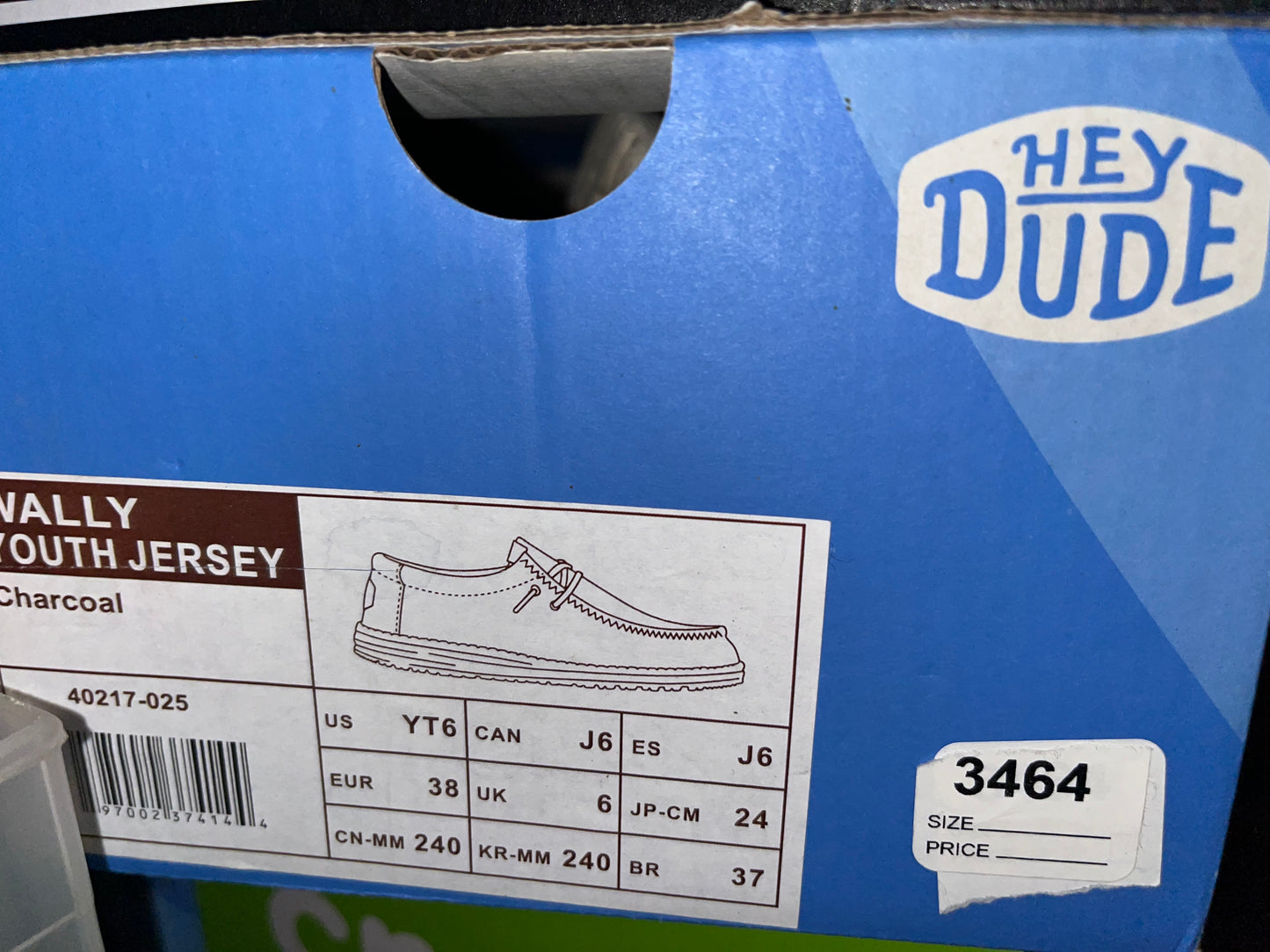 Hey Dude Wally Youth Jersey shoes in Charcoal, size US YT6. The style number for this shoe is 40217-025. These are slip-on shoes with a breathable fabric upper and cushioned insole designed for comfort.