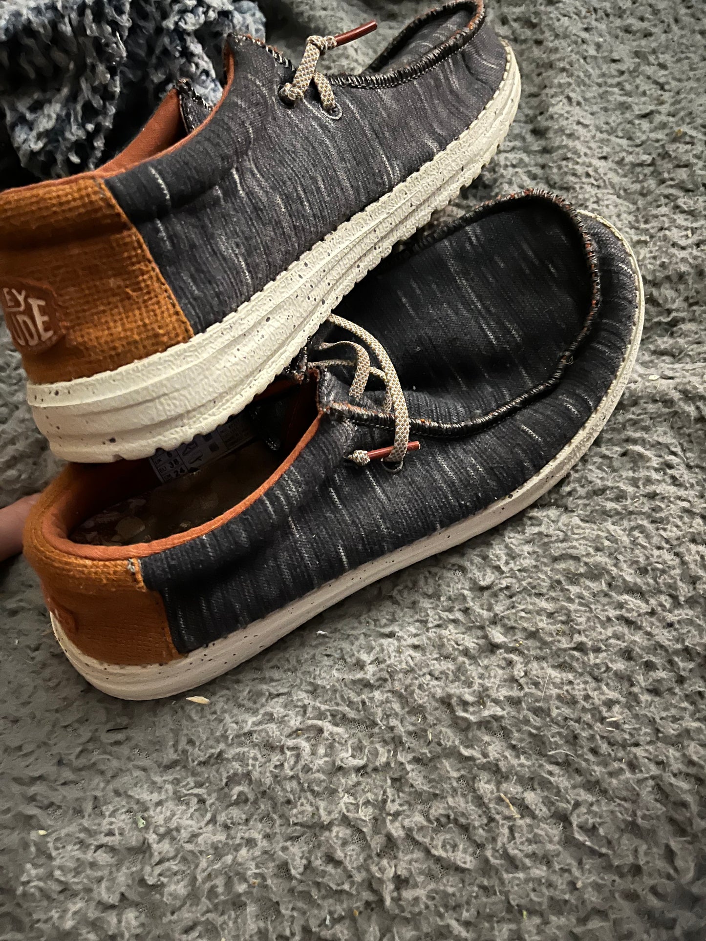 Hey Dude Wally Youth Jersey shoes in Charcoal, size US YT6. The style number for this shoe is 40217-025. These are slip-on shoes with a breathable fabric upper and cushioned insole designed for comfort.